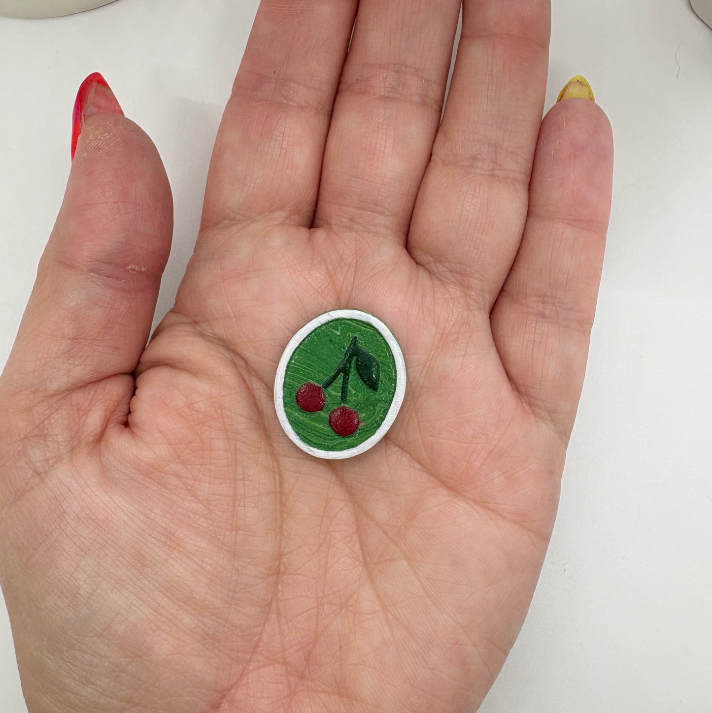 Portrait studs in Green Cherries