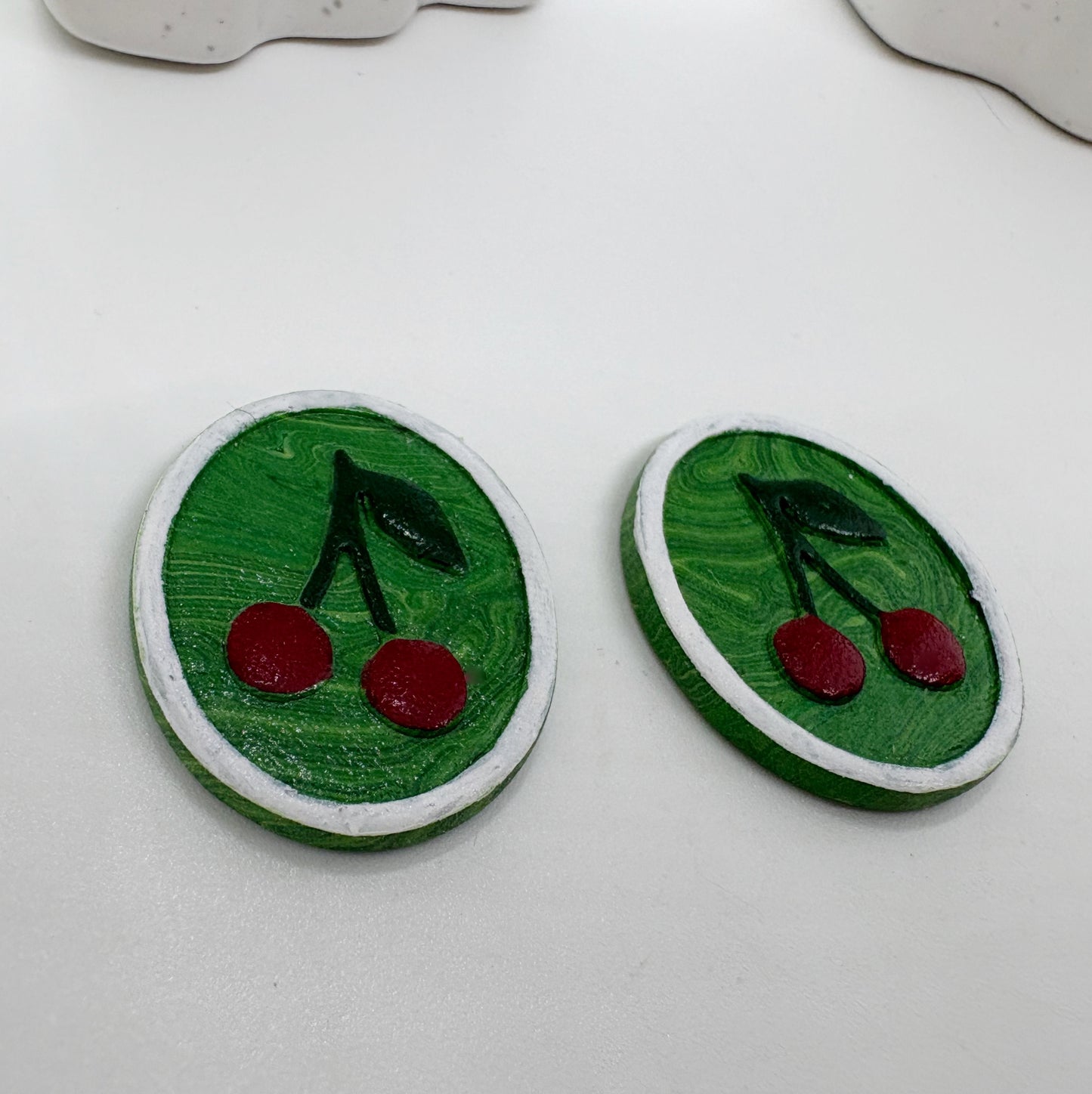 Portrait studs in Green Cherries